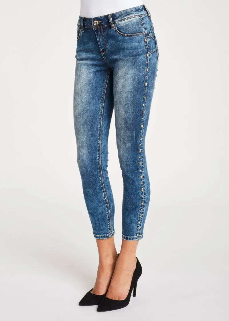 Jeans skinny cropped con borchie