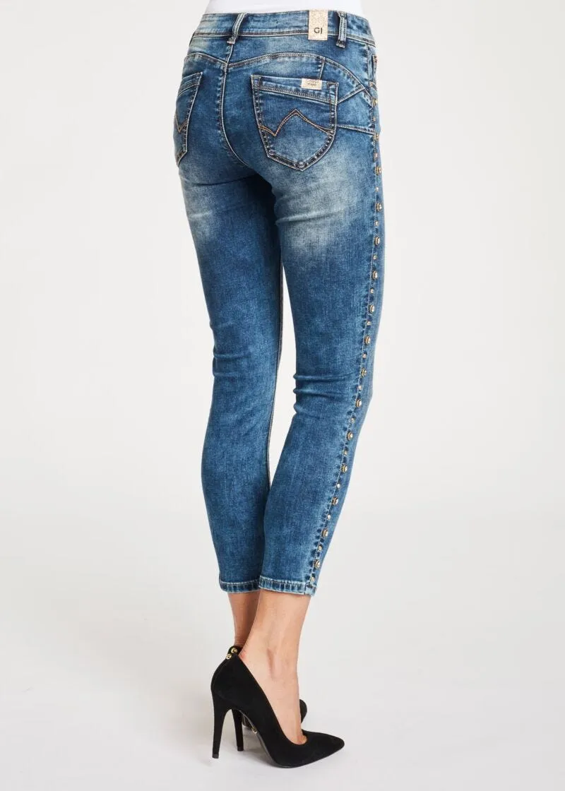Jeans skinny cropped con borchie