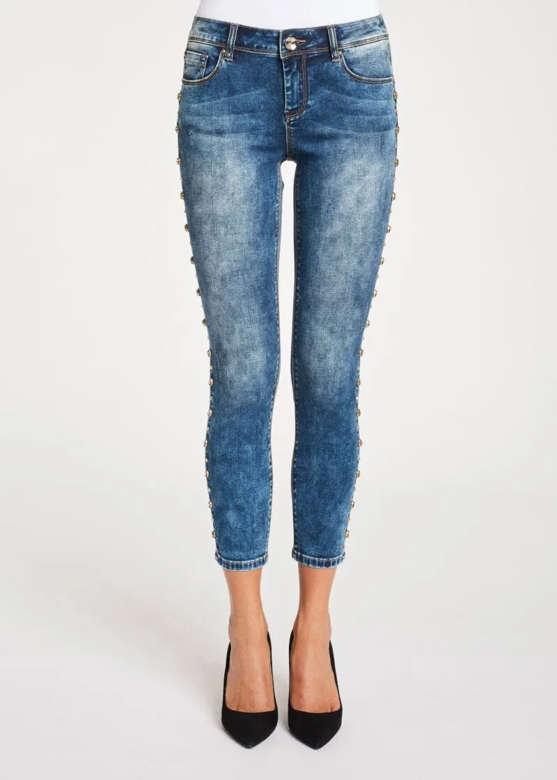 Jeans skinny cropped con borchie