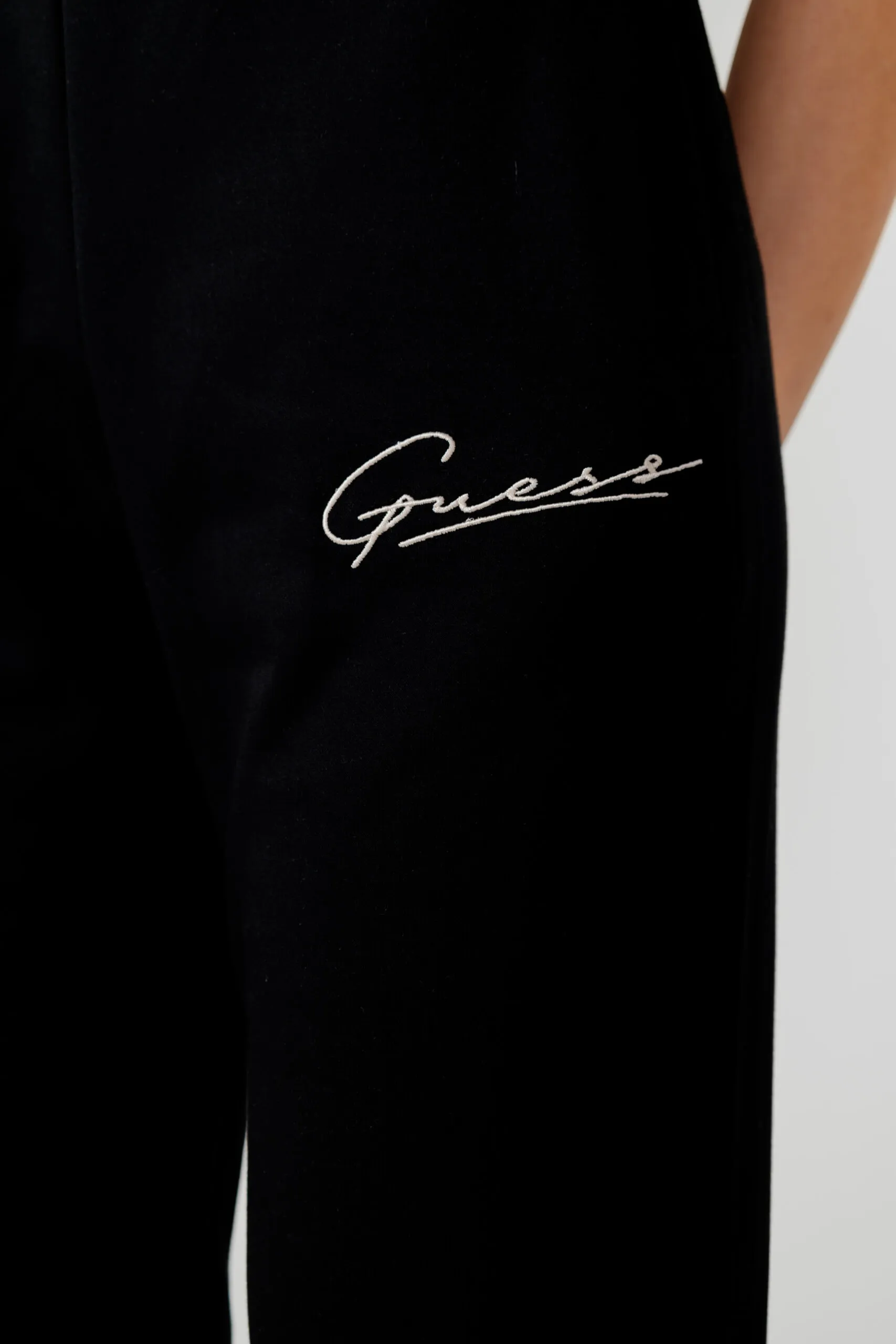Pantaloni sportivi Guess Active ALLYCIA CUFF LONG Nero